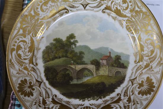 Three 19th century Derby plates, painted with named views, In Germany, On the River Derwent and Near Derby, 22.5cm